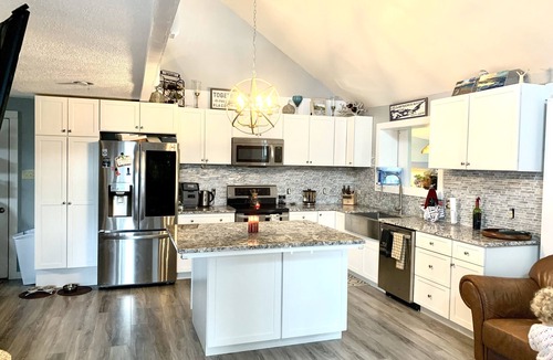 Clayton House | Walkable, modern, spacious village home, dockage, hot tub, fenced in yard.