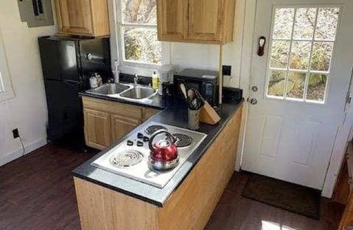 Grantham Cabin | Waterfront Cabin- look down on water from deck, private docks & fire pit