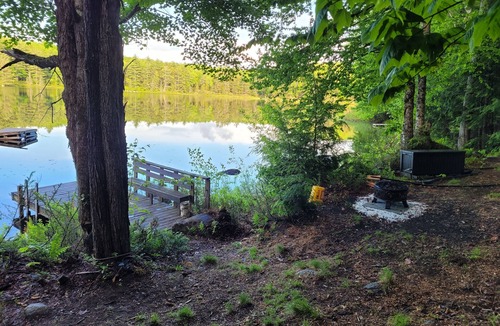 Grantham Cabin | Waterfront Cabin- look down on water from deck, private docks & fire pit