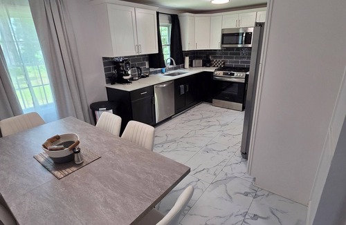 Windsor Locks House | Welcome to The Hangar, a newly remodeled travel-themed stay, 4 minutes from BDL.