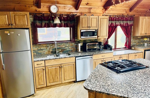 Champion House | Wooded cabin in the Laurel Highlands with beautiful yard and native trout stream