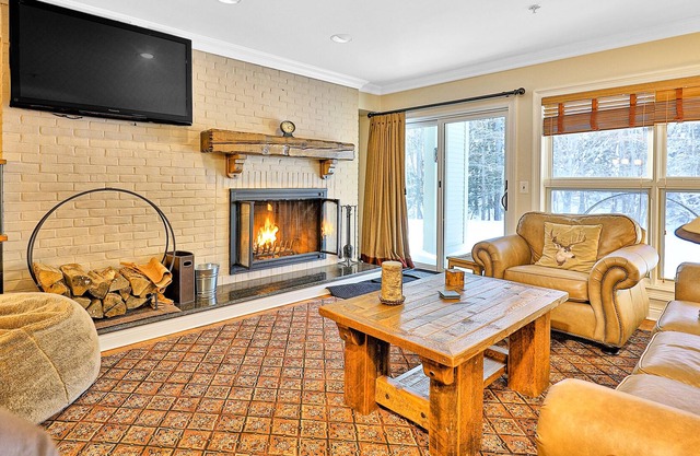 Ultimate ski-in/out condo with mountain views, hot tub, & fireplace