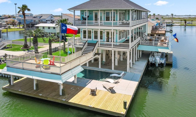 Jamaica Beach House | Dreams Float! - Expansive Decks, Pool, Elev, 2 Masters - Canal w Epic Views