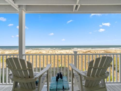 Carolina Beach Apartment | Surf Break - Feel your stress melt away as you relax on the ocean view deck and listen to the waves crash condo